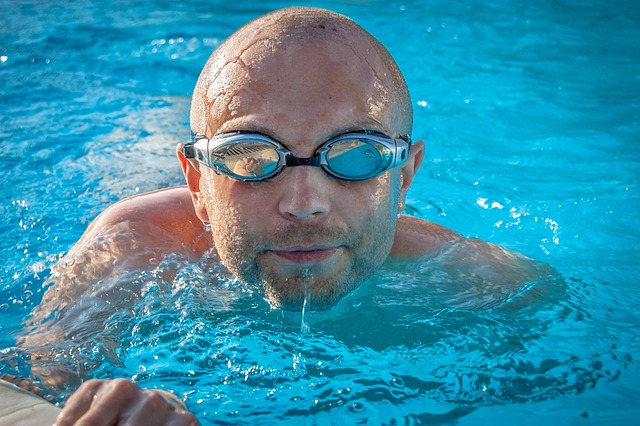 Swimmer pushing off the wall during a fast-paced practice