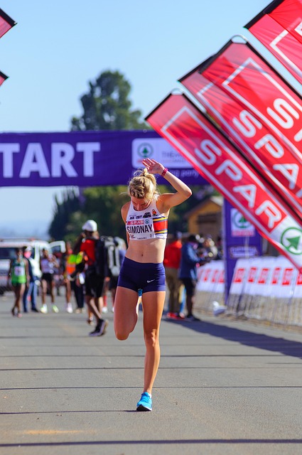 Runners at the starting line of a marathon, anticipation in the air